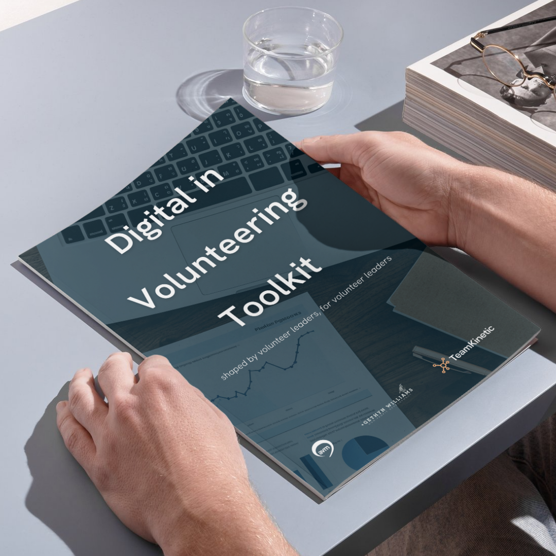 A photo of the Digital in Volunteering Toolkit in someone's hands.